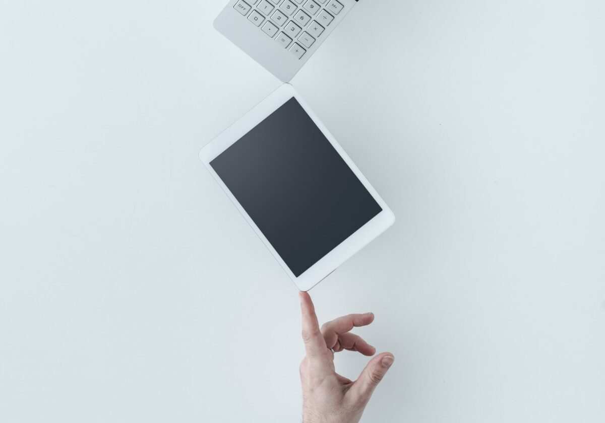 Balancing a tablet and calculator on one finger