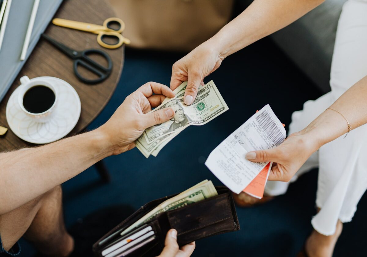 Two people exchanging cash