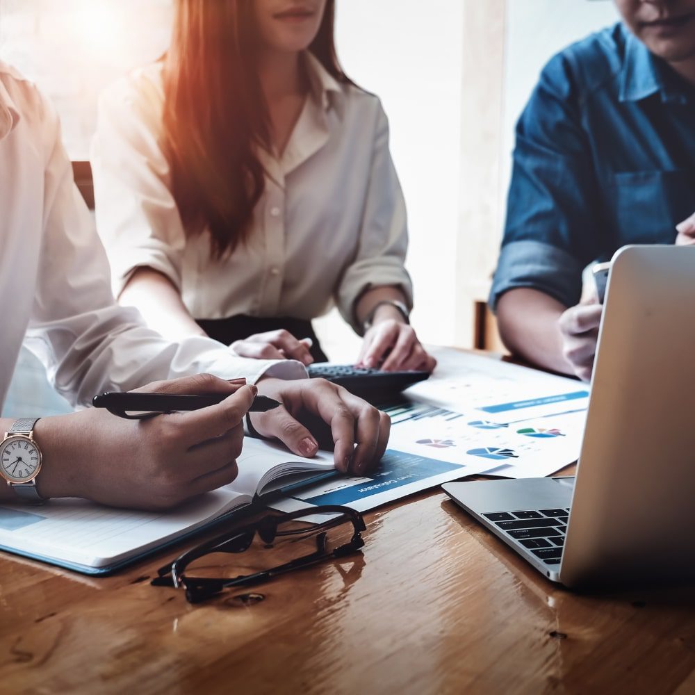 Small business team working around a laptop