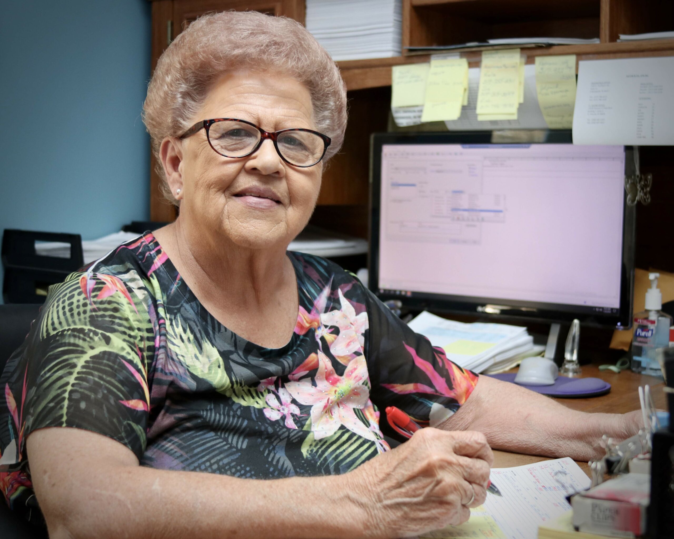 Pattar CPA team member filling out form at her desk