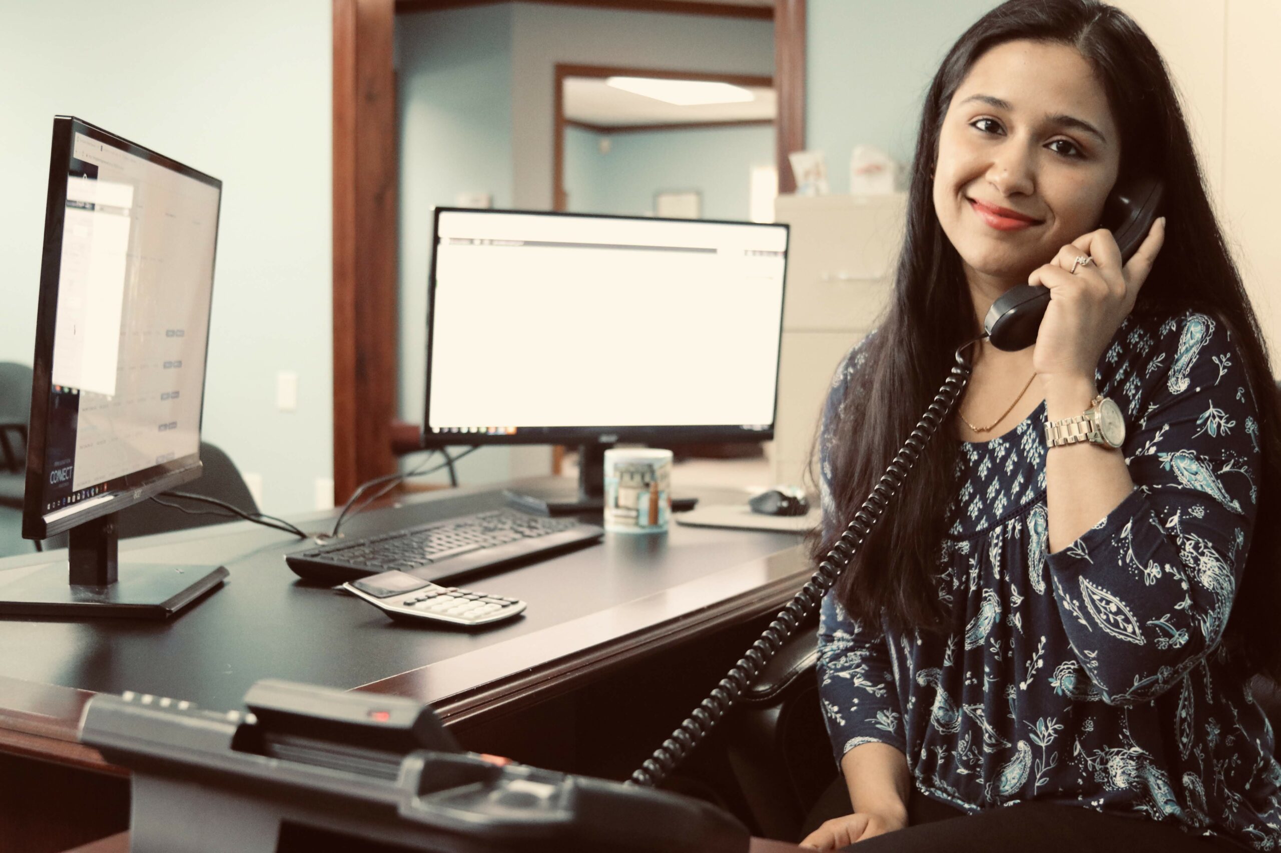 Pattar CPA team member answering a call at her desk